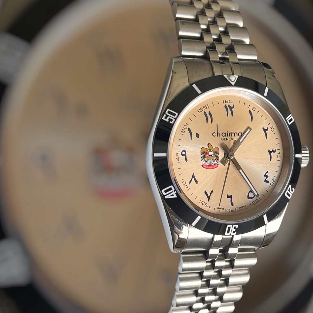 UAE Emblem Chairman Geneve Arabic Baby Orange Dial Silver Chain Gents Watch